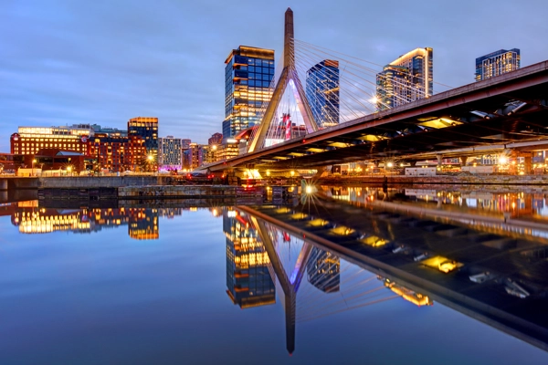 city bridge at night leading to city