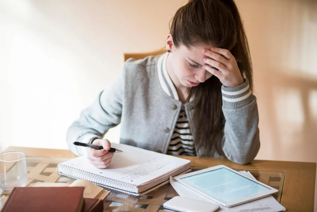 frustrated student working on homework